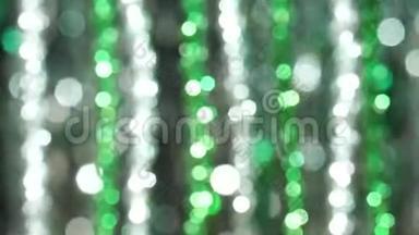 神奇的抽象闪亮的背景与银和绿色的离焦。 圣诞主题的美丽<strong>动态背景</strong>